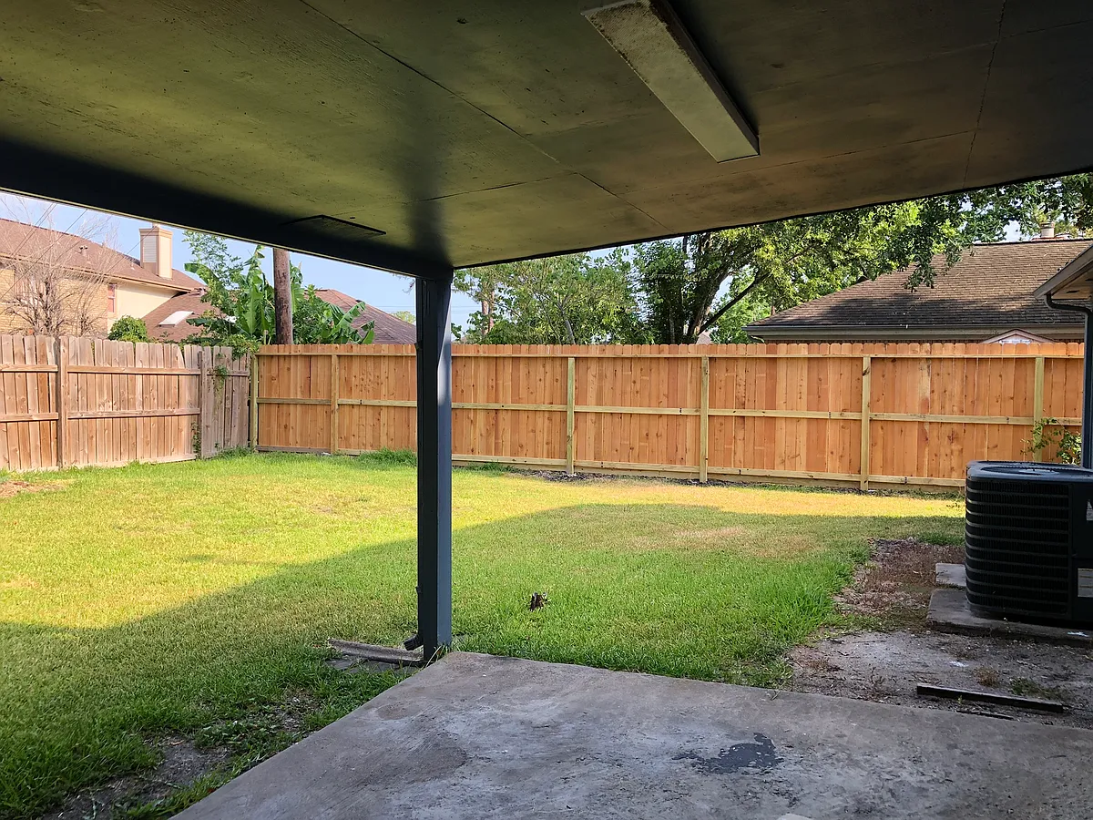 Covered patio with spacious and enclosed backyard. - 2507 Manorwood St