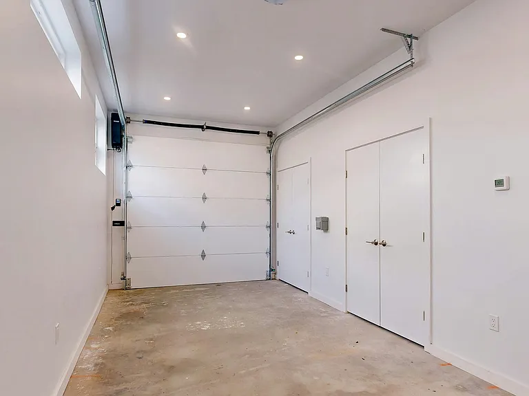 Heated garage w laundry and storage.