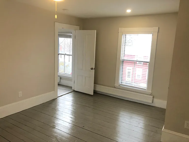 Upstairs bedroom off kitchen.