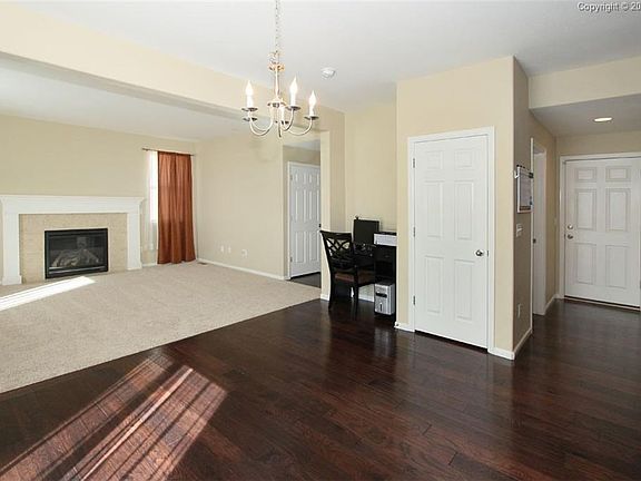 Family room has a spacious layout that opens to a dining space.