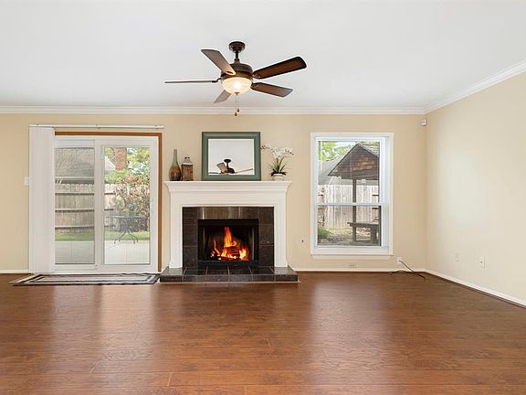 Sit by the fire, read a book and enjoy the view of your gorgeous backyard from your living room.