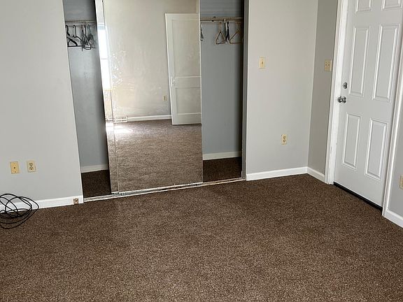 Bedroom closet with mirror doors
