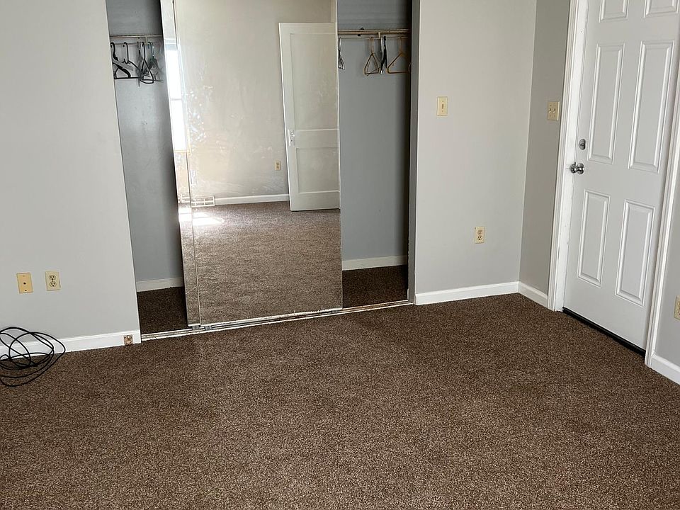 Bedroom closet with mirror doors