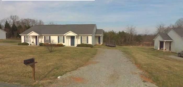 front view with gravel drive way