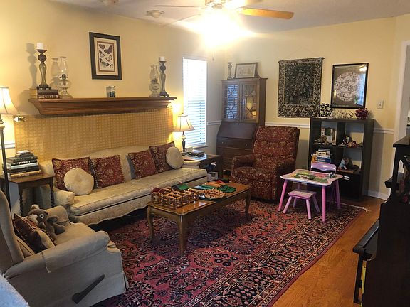 Living room. There is a fire place behind the couch!