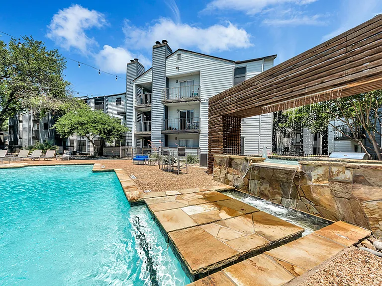 Another view of our resort-style pool with lounge seating and sun deck.