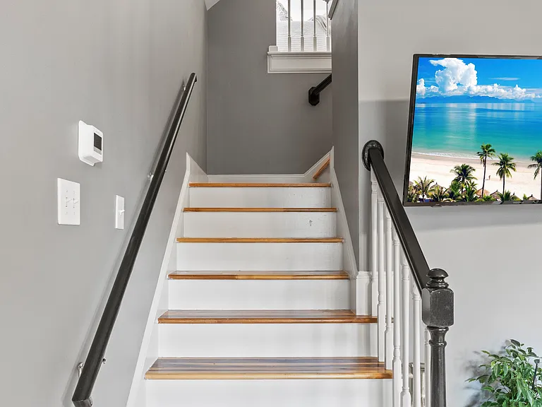 Upper level features bedroom, bathroom and working space with desk!