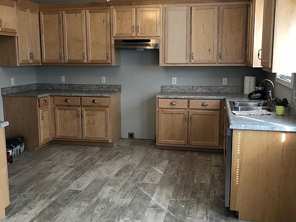 Please note this photo was made during Construction there are stainless steel appliances stove and fridge in the home