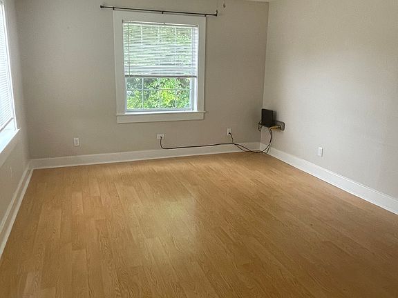 Living Room open to kitchen. Mantle with TV Mount above