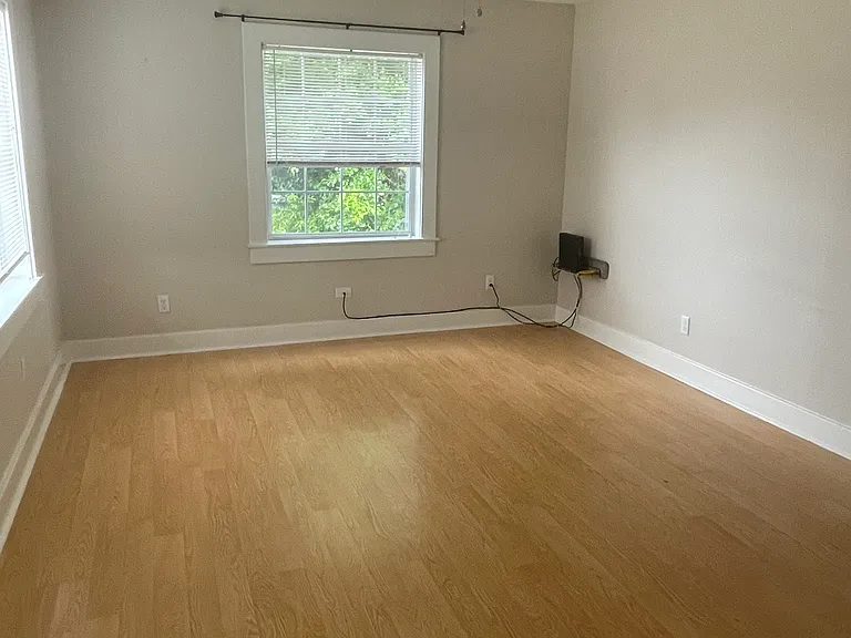 Living Room open to kitchen. Mantle with TV Mount above