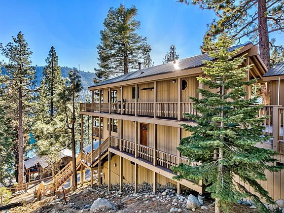 View of house from E Reed Ave with the stairs down to Donner Ave.