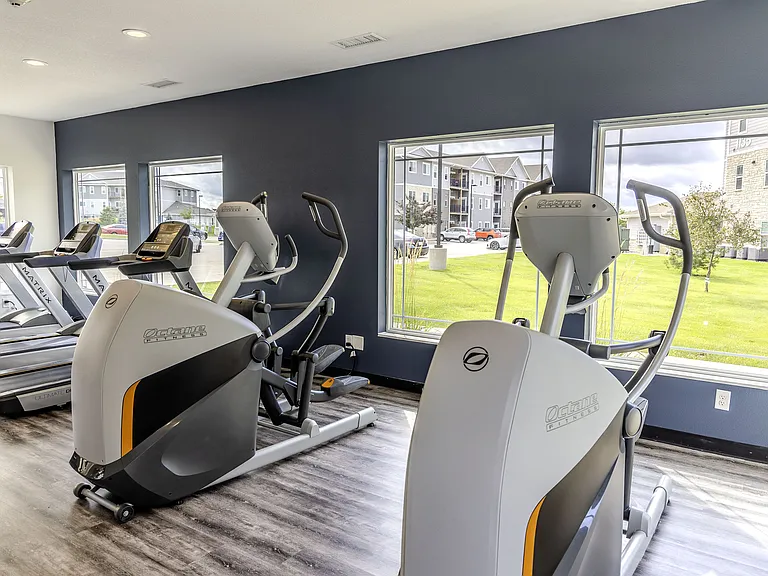 Treadmills and ellipticals are among the equipment in the fitness center for a cardio workout.