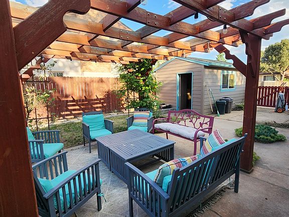 Backyard area offers ample room for hosting, games, storage, and events