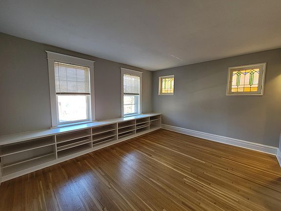 Enter into the front room, with built ins, and two lovely stained glass windows. Tons of natural light!