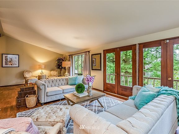 The open floor plan offers a variety of options for furniture configurations with the room running the length of the house