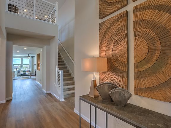 View of the entry displaying an open feel with the dining room off to the left and the upstairs acce