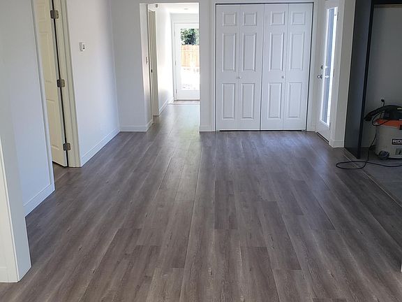 Living and dining rooms; open kitchen to right