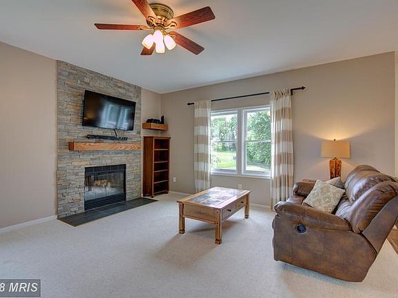 Family Room w/wood burning stone fireplace