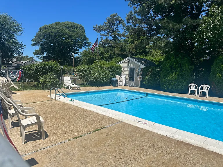 This pool is a private oasis which is tended to daily and barely used .. complete with lounge chairs , tables and umbrellas!