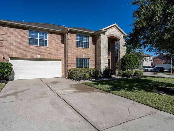 Double wide driveway offers additional parking for your guest.