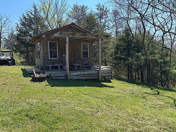 Log cabin on top of hill