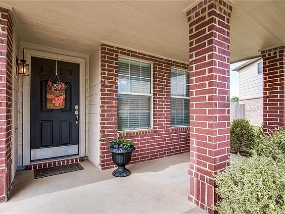 Such a delightful front porch to greet family and friends.