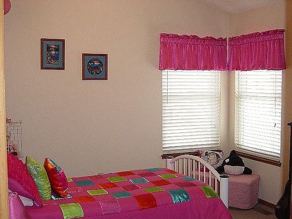 Bedroom #2 with ceiling fan.