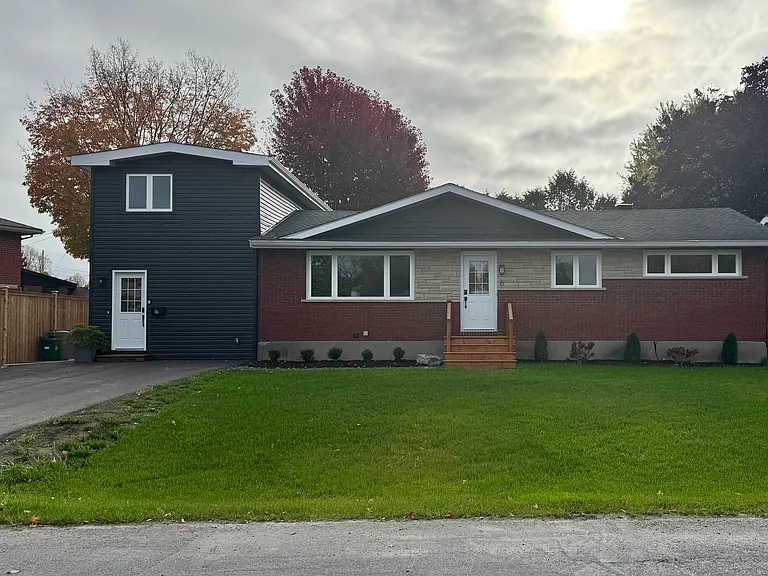 Charming residential exterior of our Ottawa furnished rental, perfect for families seeking a peaceful, private home.