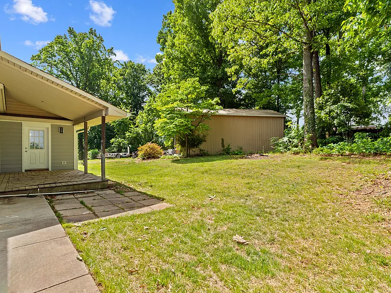 Back yard with covered porch.