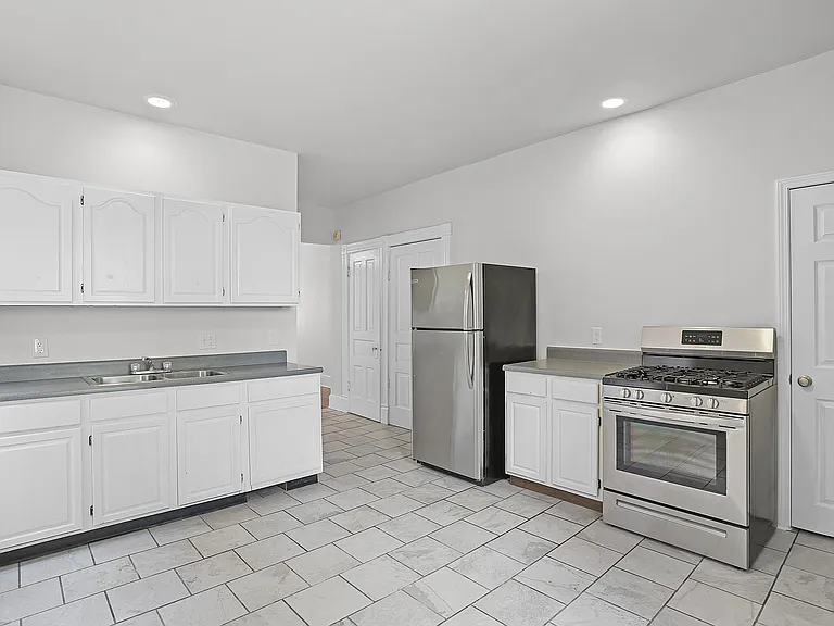 The Kitchen - ample cabinetry and countertop space, stainless steel appliances, ceiling fan
