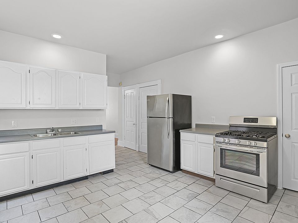 The Kitchen - ample cabinetry and countertop space, stainless steel appliances, ceiling fan