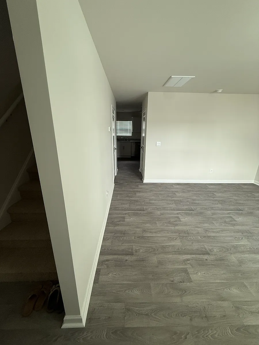 View from front door. Left: Stairs. Right: Living Room. - 4101 Laurel Ridge Dr #F