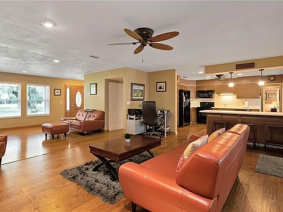 Living area off front entry overlooking the kitchen