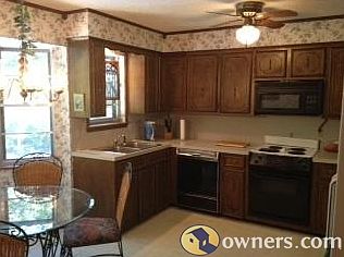 A view from the dining room into the kitchen on the mid-level