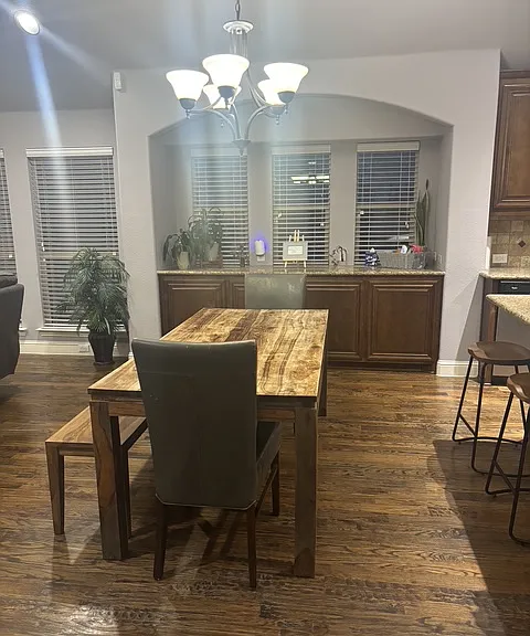 dining table and character filled cabinetry