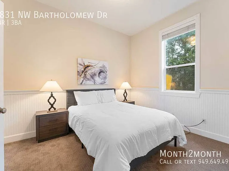 9831 NW Bartholomew Dr — Photo 16
