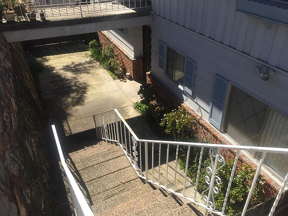stairs heading down to front patio and front door