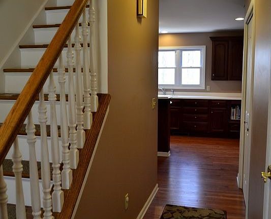 Entry way. First floor is all hardwood and has a flat ceiling.