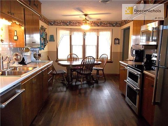 Dining area with lots of natural lighting all new appliances in Kitchen.