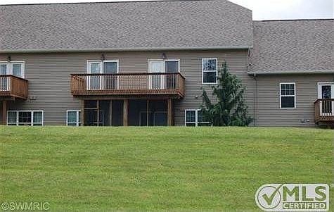 Back view showing deck and screened in porch