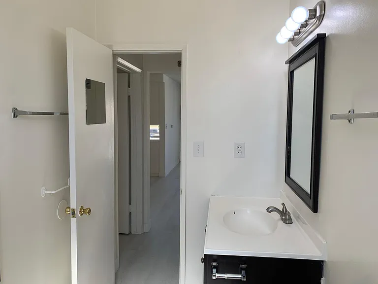 Bathroom features both shower and bathtub.
