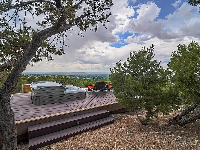 Approaching the private hot tub deck tucked amongst trees but with a view...