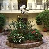 The charming courtyard. Dining area and kitchen have windows in the courtyard.