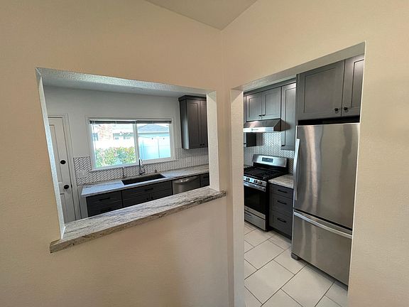 view through kitchen to backyard