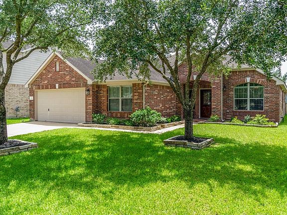 2 car garage with peg board. Great curb appeal, beautiful landscaping.