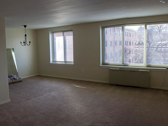Living area with enough space for dining area and large seating area and office area.