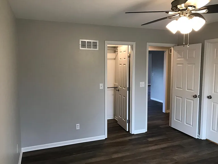 Bedroom 2 with walk in closet and bathroom access that also opens to hall for company access.