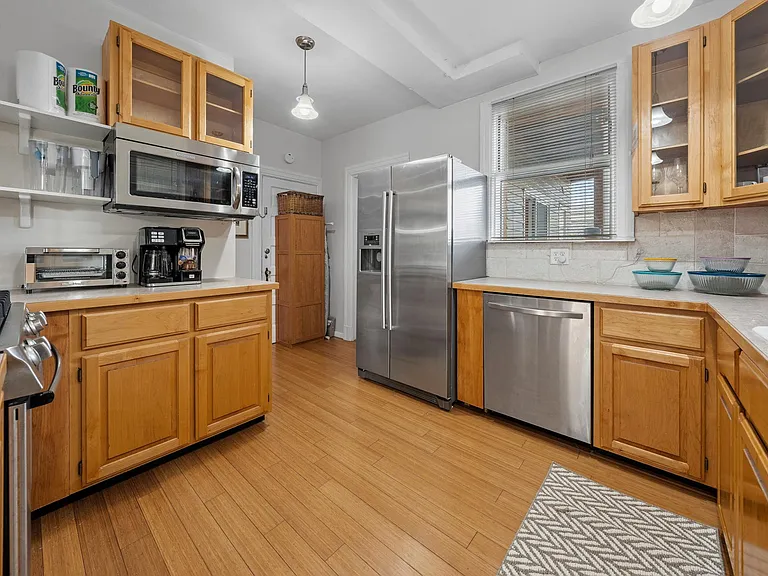 Large kitchen will major appliances. Includes convection toaster oven/air fryer; dual coffee maker (drip and K cups); hand mixer, rice cooker, and slow cooker.