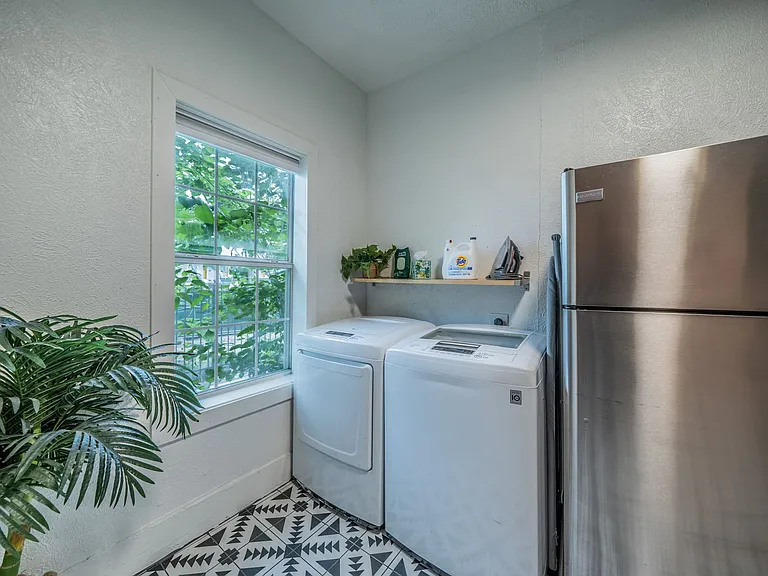 Convenient in-unit laundry area right next to the kitchen.