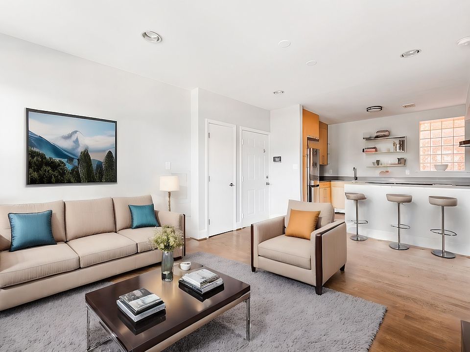 open concept living room and kitchen, virtually staged